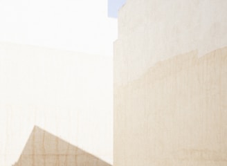 a man riding a skateboard down a street next to tall buildings