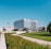white concrete building near green grass field during daytime